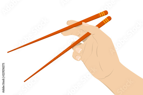 Hand holding asian chinese couple of chopstick