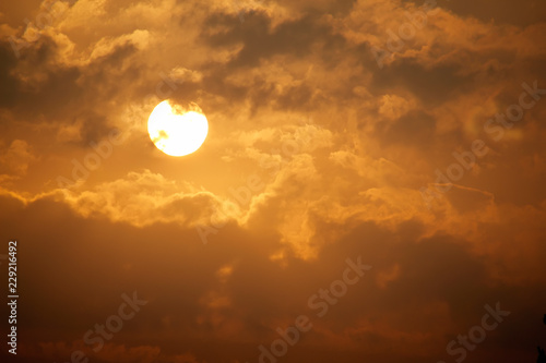 This beautiful golden sunrise with painterly clouds and large golder sun would make for a beautiful background for nature or inspirational illustrations.