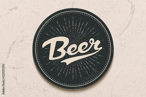 Coaster for beer with hand drawn lettering Beer. Monochrome vintage drawing for bar, pub and beer themes. Black circle for placing a beer mug or a bottle over it with lettering. Vector Illustration
