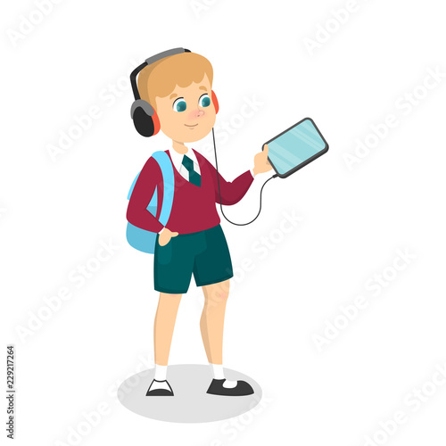 Smiling schoolkid holding gadget in the arms