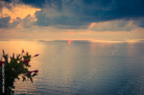 Aerial view of beautiful amazing sea sunset with color dramatic sky