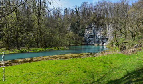 Krupa Spring (Izvir Krupa) in Bela Krajina, southern Slovenia, is a big karst spring below rock wall. It is protected as natural heritage and special habitat of water spices.