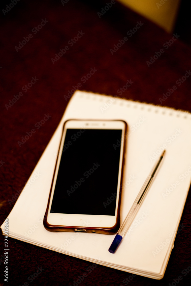 mobile phone, notebook and pen mobile phone, notebook and pen