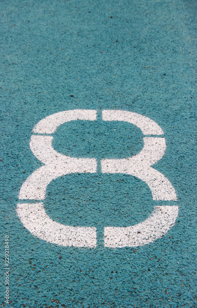 Fototapeta premium digit 8 on a blue athltetics track