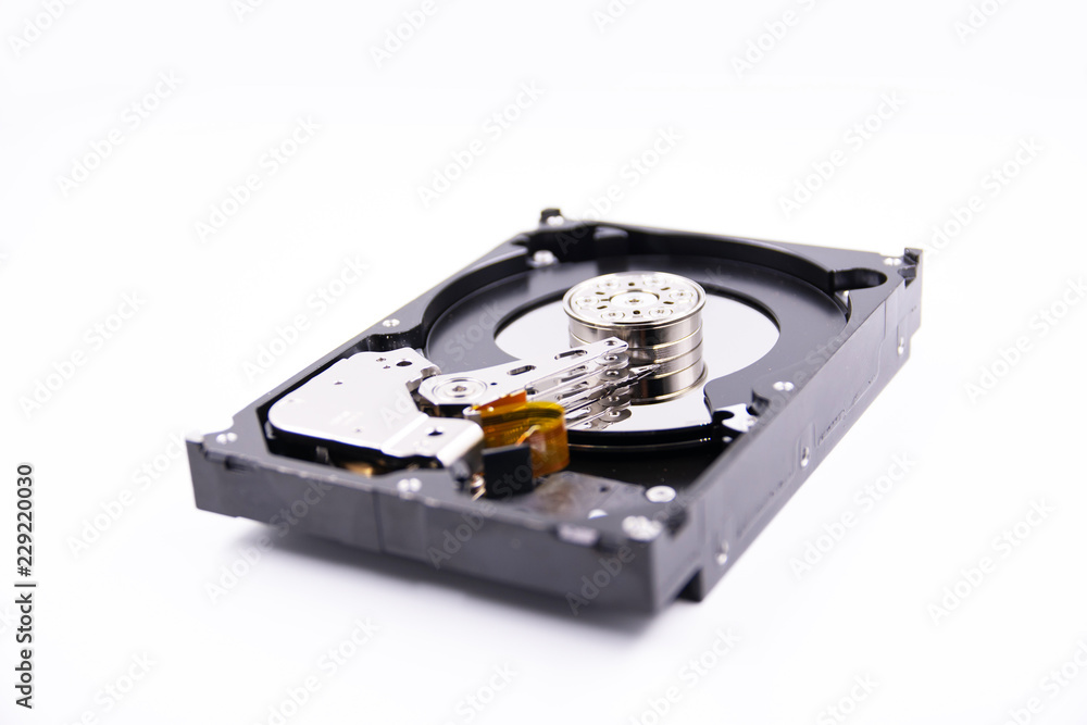 hard drive with the lid open on a white background hard drive with the lid open on a white background