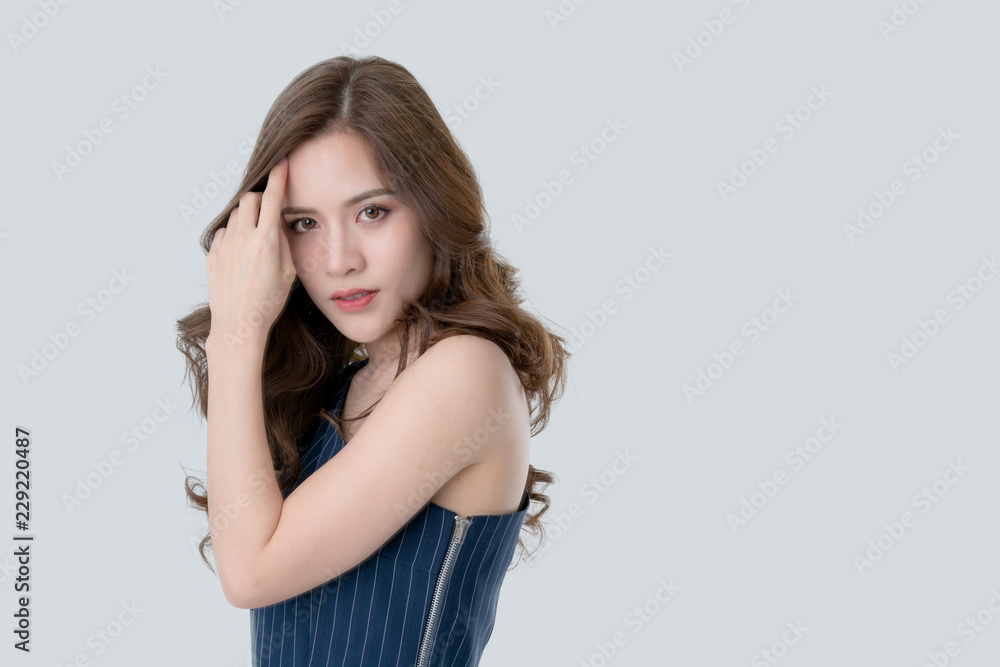 beautiful attractive elegance asian woman in blue dress hand touch face model pose on studio photo shoot isolate white background beautiful attractive elegance asian woman in blue dress hand touch face model pose on studio photo shoot isolate white background