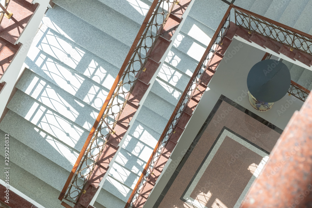 Obraz premium Marble staircase with railing top view.