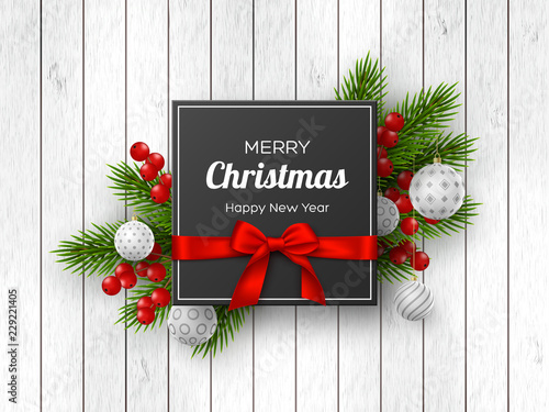 Christmas holiday design. Realistic 3d balls, fir-tree branches, berries and label with silk bow on wooden texture. New Year background. Vector illustration.