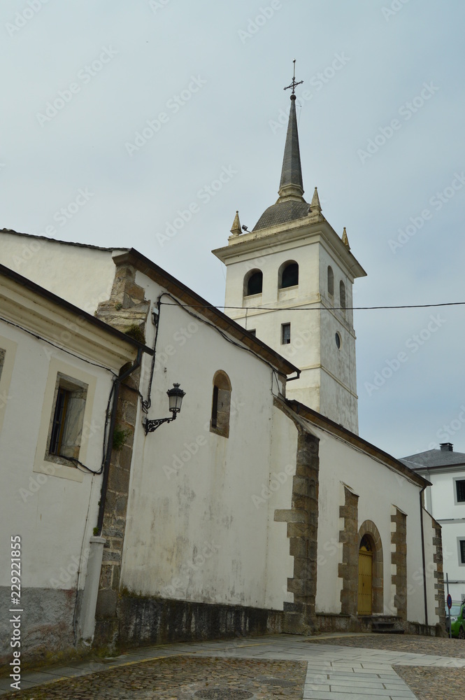 Fototapeta premium Facade And Bell Tower Of The Church Santiago Apostol De Castropol. August 2, 2018. Architecture, Nature, Travel. Castropol, Asturias, Spain.