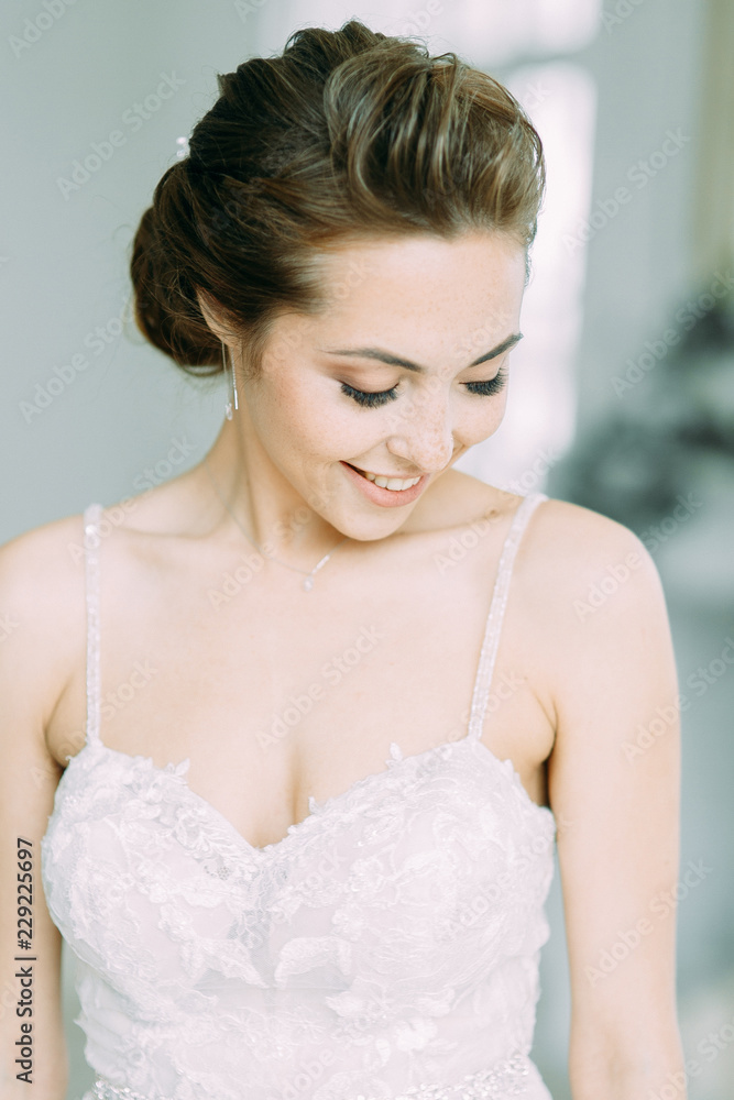 Beautiful bride in a white Studio. Russian wedding in St. Petersburg. Portrait and details in fine art style. Beautiful bride in a white Studio. Russian wedding in St. Petersburg. Portrait and details in fine art style.