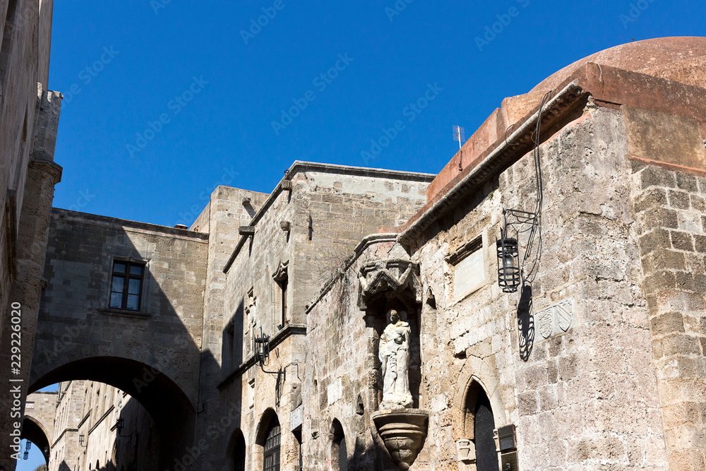 Rhodes Old City - Street of the Knights, statue of Virgin and Child, facade of the Langue of France, Greece
