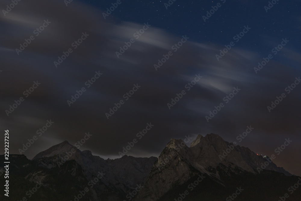 Clouds over mountain long time exposure nighttime