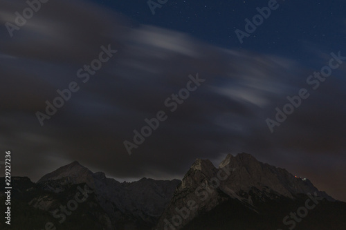 Clouds over mountain long time exposure nighttime