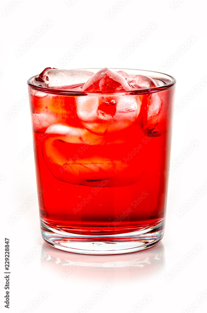 red drink with ice cubes on white background