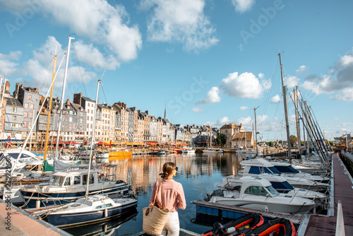 Fotografía Young woman tourist enjoying beautiful view on the harbour traveling in Honfleur