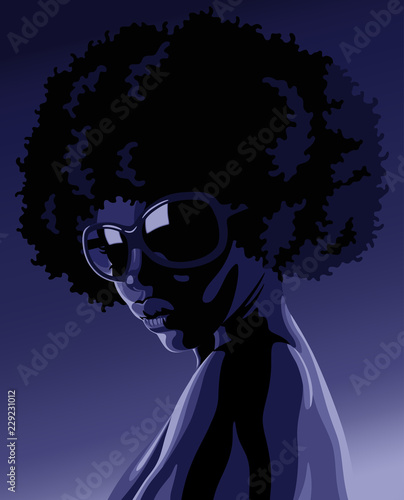 Beautiful young black woman with sunglasses in chiaroscuro lighting