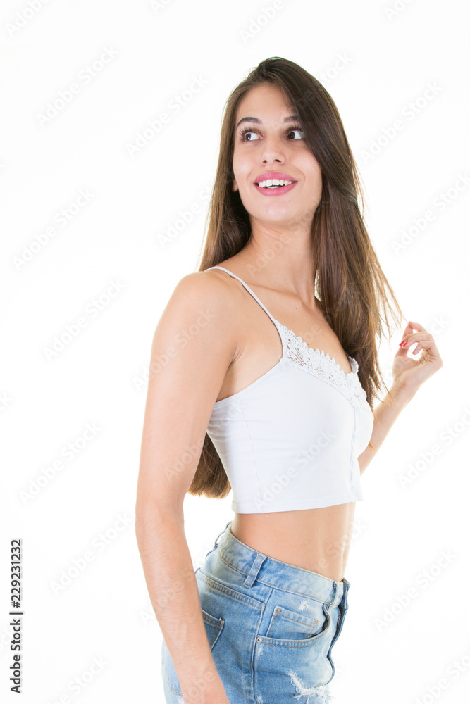 Joyful teenager young woman standing isolated on white background Joyful teenager young woman standing isolated on white background