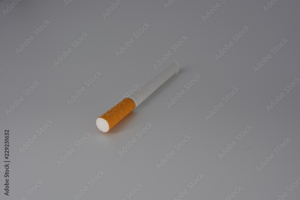 Cigarette, cigarettes with tobacco and cigarette sets on a white background, smoking and harm to health Cigarette, cigarettes with tobacco and cigarette sets on a white background, smoking and harm to health