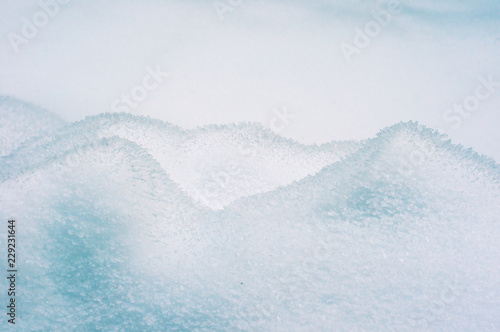 Fototapeta Naklejka Na Ścianę i Meble -  Snowdrift texture in minimalistic style. Close up  fresh snow pattern.