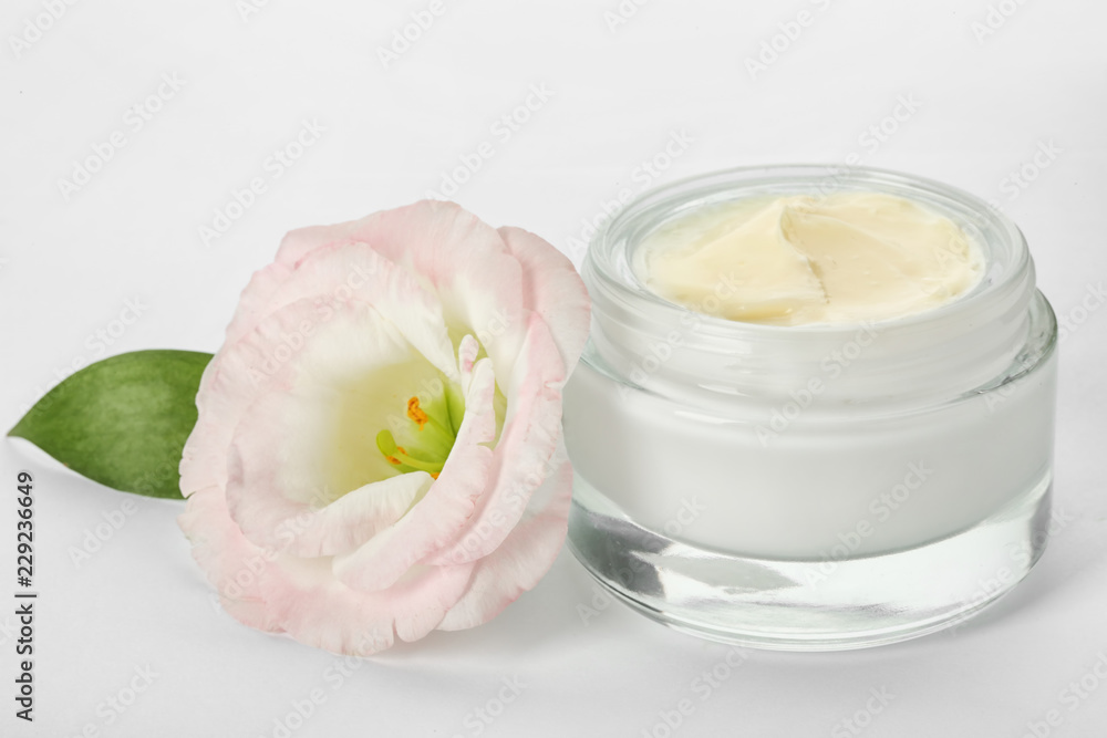 Jar with cream and flower on white background. Hand care cosmetics Jar with cream and flower on white background. Hand care cosmetics