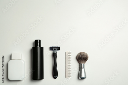 Fototapeta Naklejka Na Ścianę i Meble -  Flat lay composition with men's shaving accessories and space for text on white background