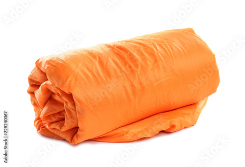 Rolled sleeping bag on white background. Camping equipment