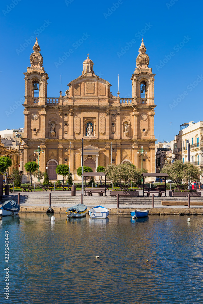 Msida, Malta. The picturesque facade of the baroque church of St. Joseph on the embankment, 1889