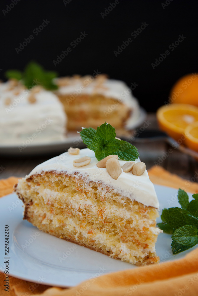 Orange and carrot cake, wooden background. Rustic style. Orange and carrot cake, wooden background. Rustic style.