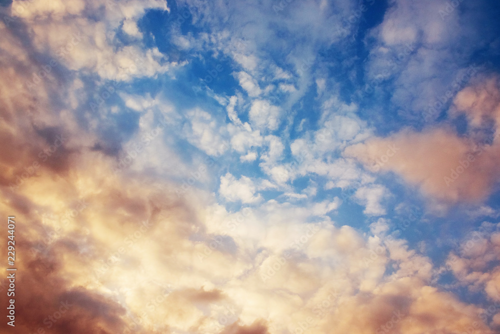 Dramatic sky with clouds background. Blue sky with colored clouds.