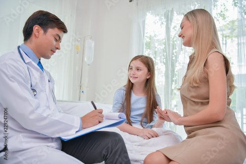 Health Concepts. The doctor is examining the health of the child. Parents take the child to the doctor at the hospital.