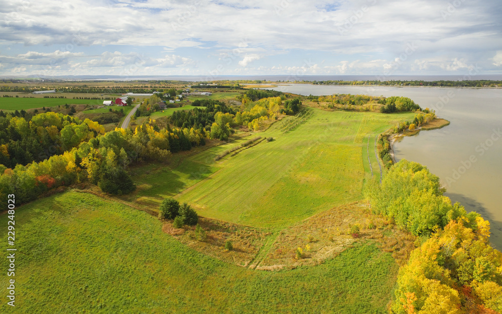 Autumn aerial view of farmland and lake