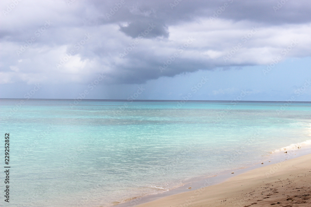 Light blue sea shore and sand