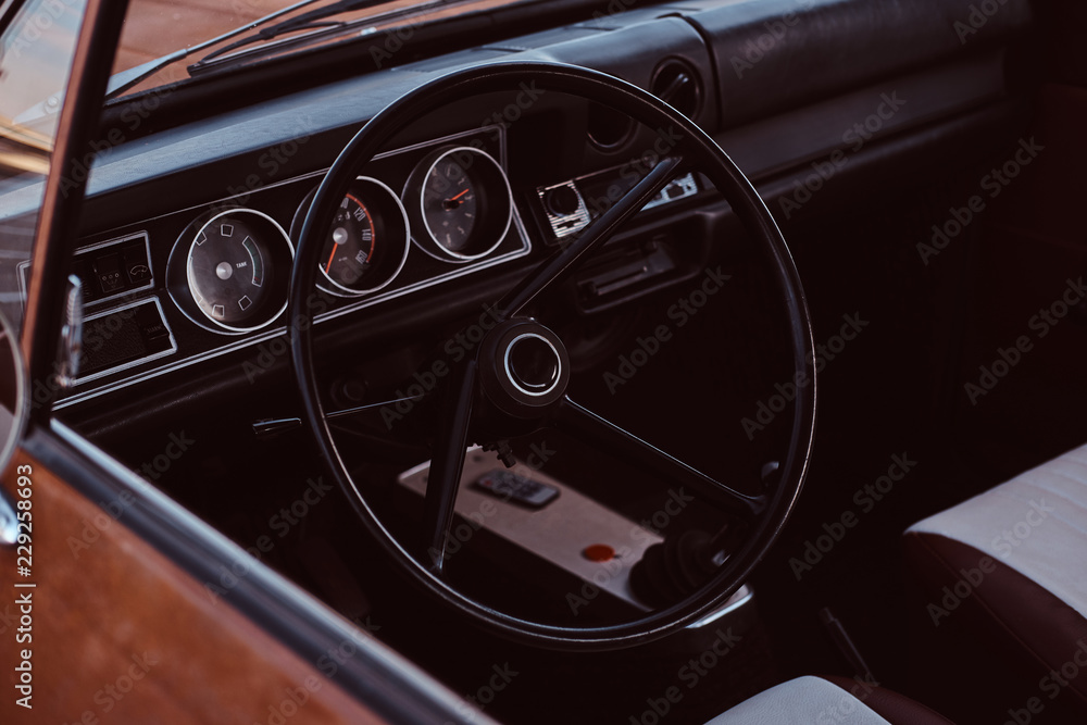 Steering wheel and dashboard. Interior of a restored retro car.
