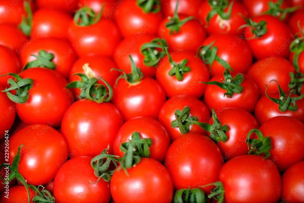Fresh red tomato abstract fruit colorful pattern texture background. Shallow depth of field. Fresh red tomato abstract fruit colorful pattern texture background. Shallow depth of field.