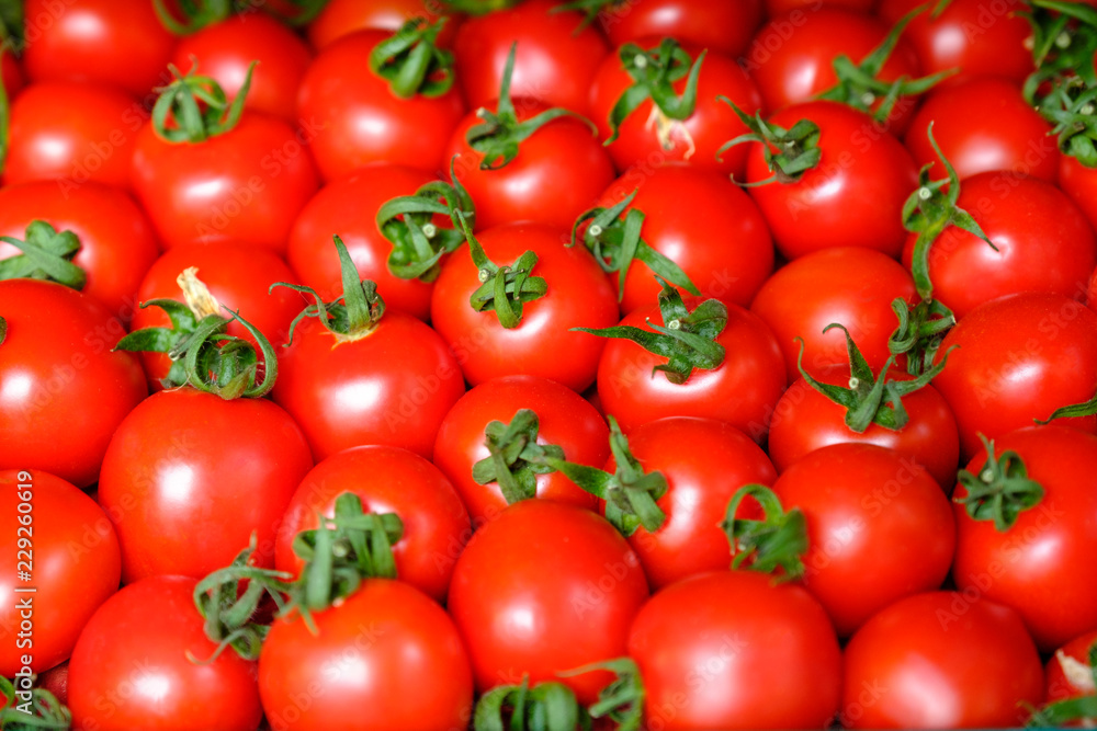 Fresh red tomato abstract fruit colorful pattern texture background. Shallow depth of field.