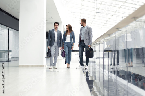 visitors walk in the lobby of the business center