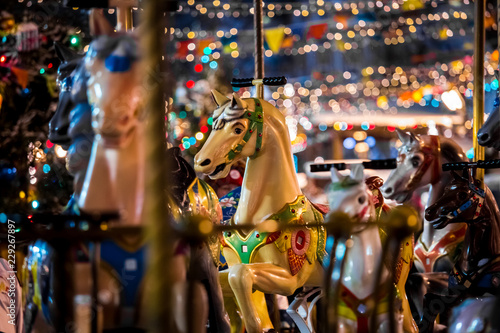 Carousel with rocking horses on christmas market in Moscow, Russia