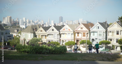Wide shot of famous painted ladies homes from Alamo Square park