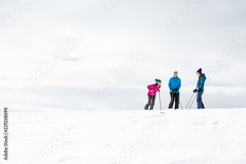 winter, skiing, woman, mountain, outdoors, happy, people, young, group, friends, smiling, white, fun, hat, beautiful, happiness, together, girls, friendship, casual, athletic, sports
