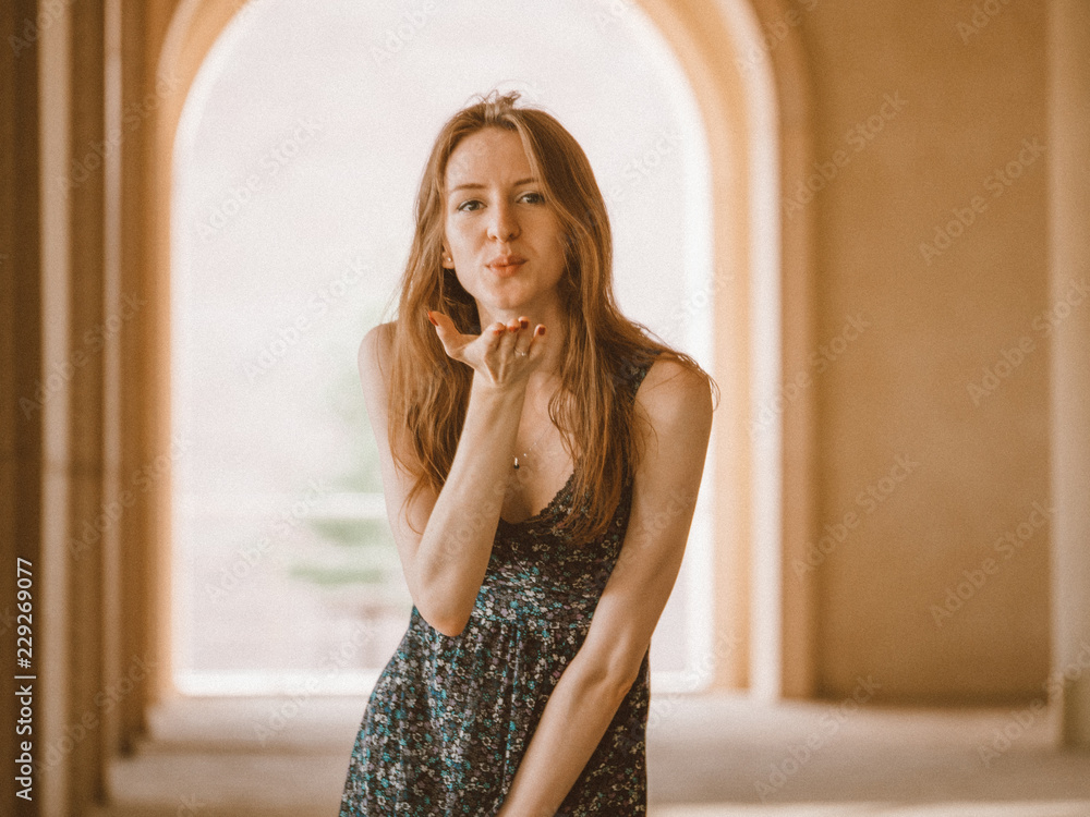 Fototapeta premium Air kiss. Portrait beautiful girls. Hot summer. Isolated