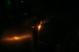 Burning Tiki torch at night