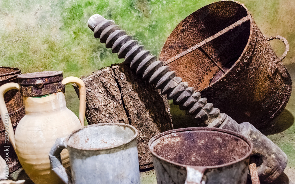 Rusty tools in an ancient underground oil mill in Italy Rusty tools in an ancient underground oil mill in Italy