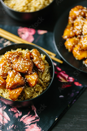 Sesame chicken on egg fried rice photo