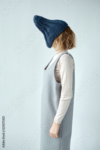 Woman with hat on face