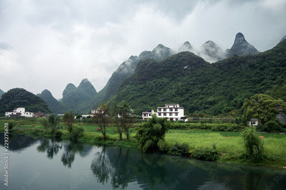Countryside view over Li river among mountains Countryside view over Li river among mountains