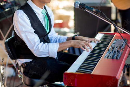 Close up of musician playing electone photo