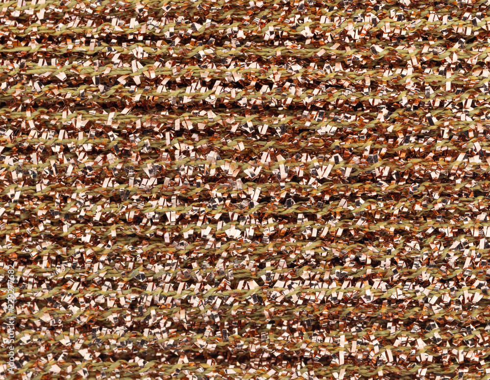 Fototapeta premium Very close view of gold glitter arts and crafts thread.