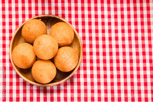 Buñuelos Colombian traditional food - Wood background