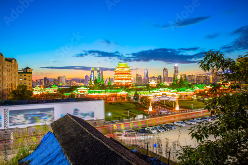 The combination of urban architecture and old architecture in Nanchang, China (the Chinese character in the ancient building is Tengwang Pavilion) photo