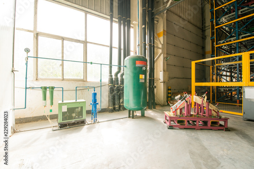 Empty workshop with a lift in a car repair station photo